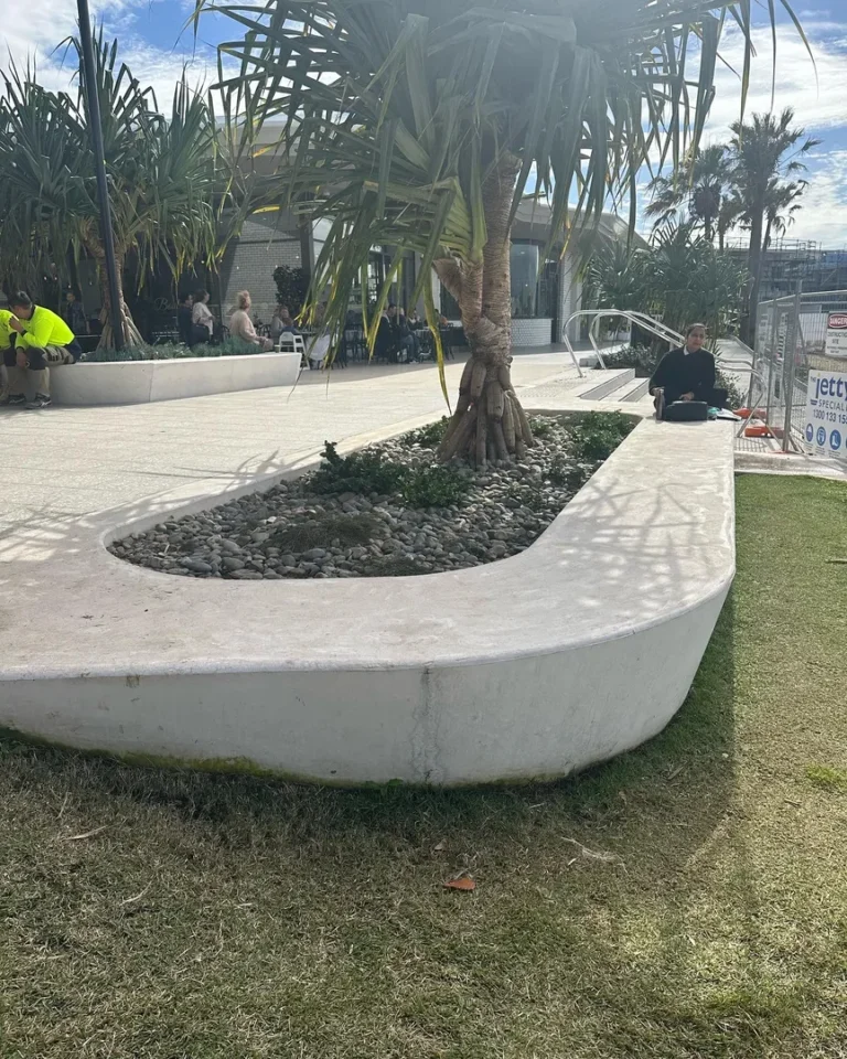 Outdoor seating area with palm trees