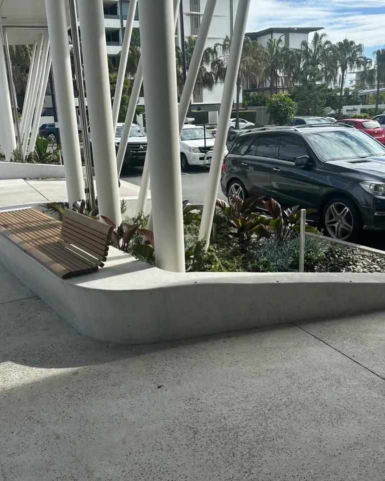 Outdoor modern bench near parking lot