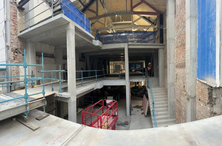 Interior view of a multi-story building under construction.