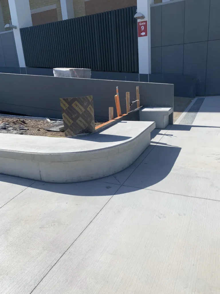 Concrete ramp under construction by Gate 9 entrance