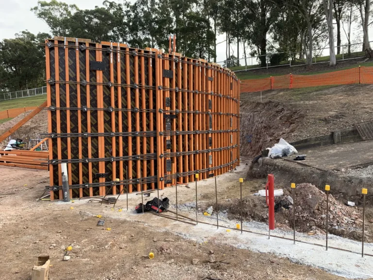 Construction site with wooden mold structure.