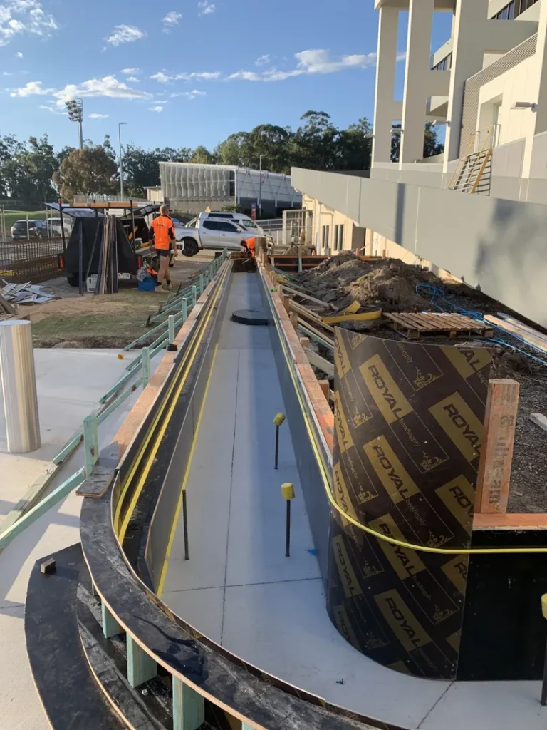 Construction site with workers and materials