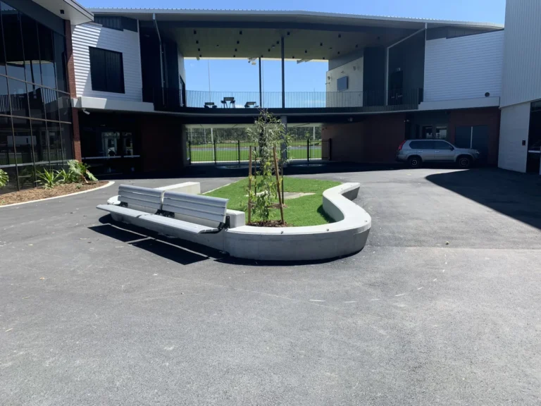 Modern building courtyard with benches and plants