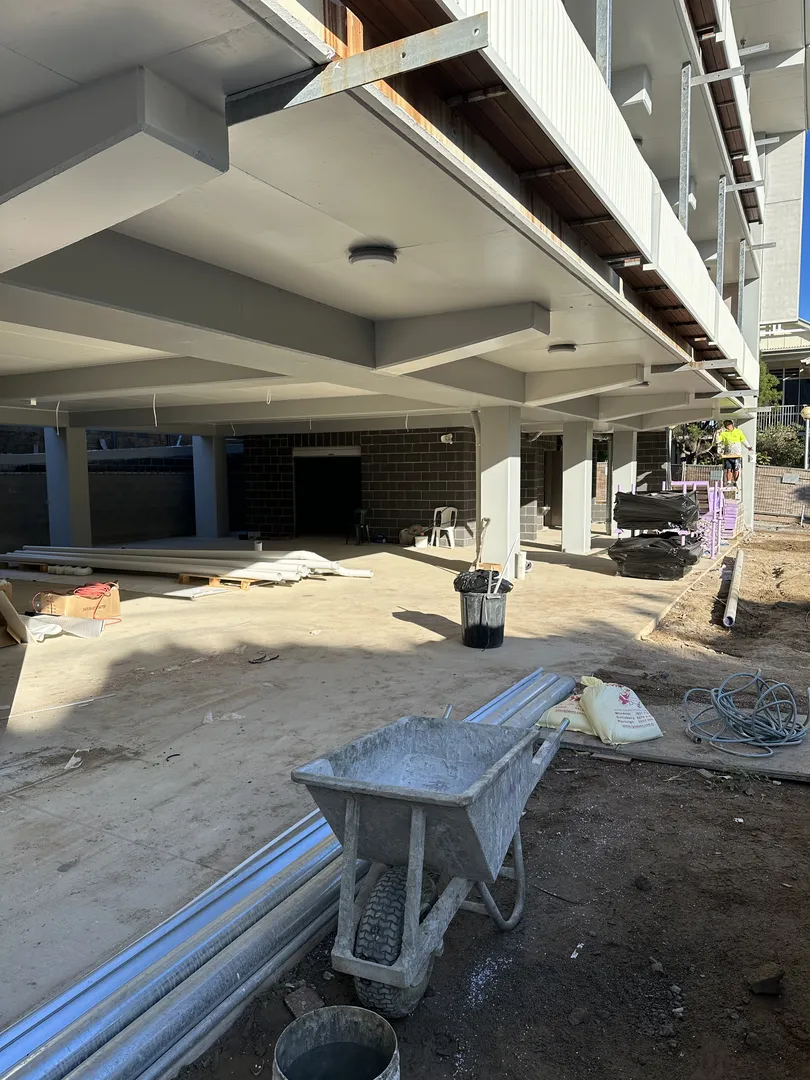 Construction site with equipment and building materials.