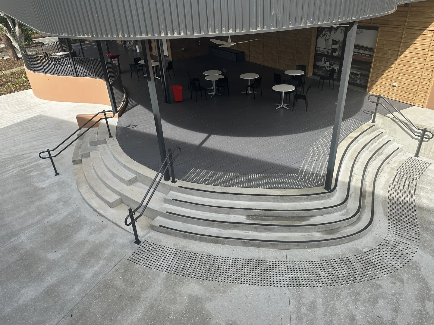 Outdoor seating area with curved steps.