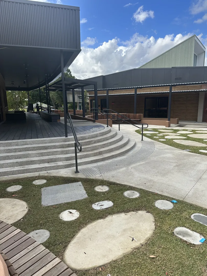 Modern building with stairs and green lawn