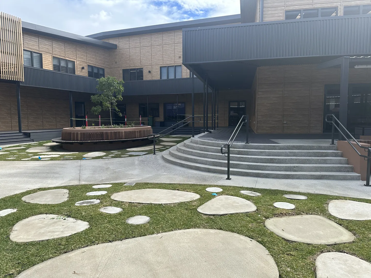 Modern courtyard with steps and stone pathway