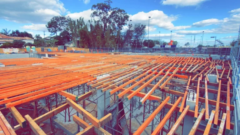 Construction site with wooden beams and scaffolding.